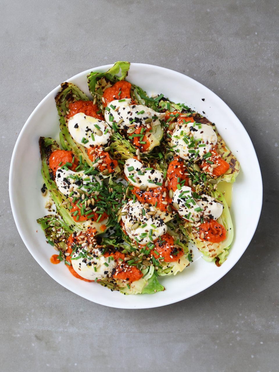 Charred hispi cabbage with tomato sauce and caraway mayo