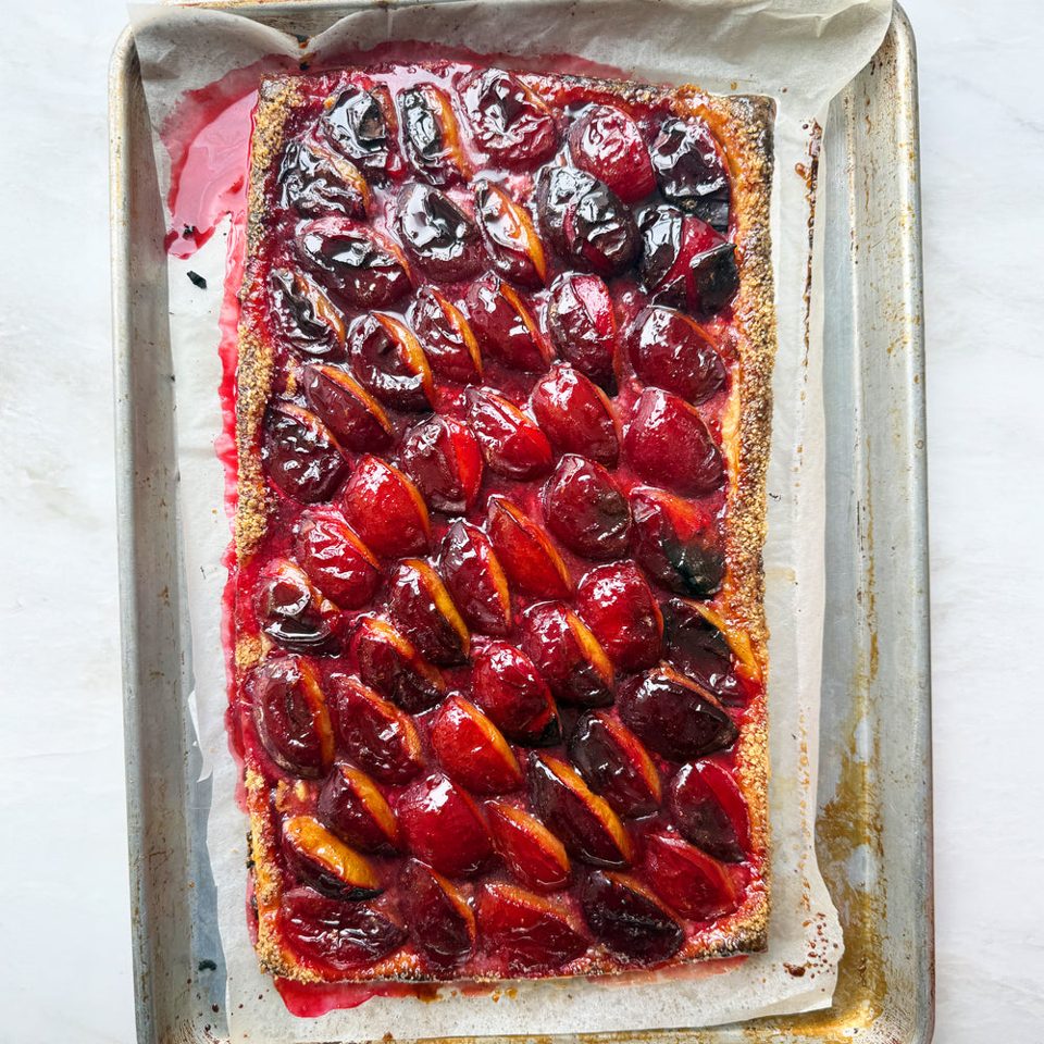 Spiced plum and marzipan tart with creme fraiche