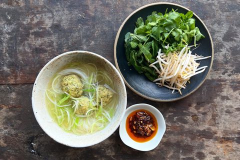 Chicken dumplings in broth with noodles and chilli oil
