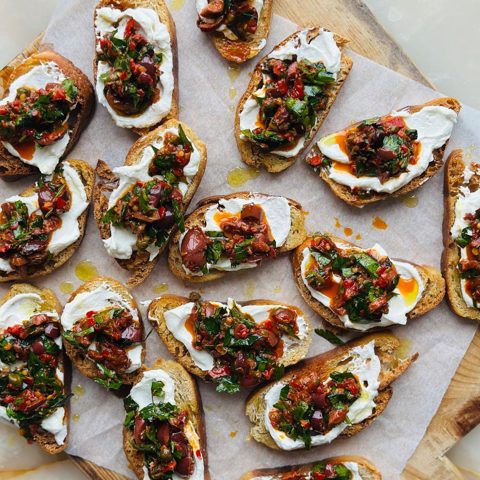 "Puttanesca" crostinis with whipped ricotta