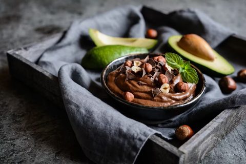 Raw Avocado Chocolate Mousse Topped with Hazelnuts