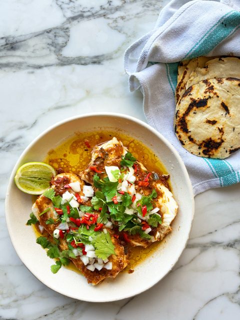 Slow-cooked hake in cascabel oil with corn tortillas
